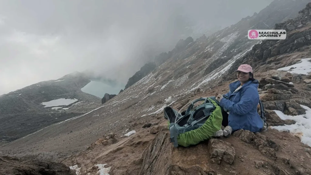 Solo female traveler hiking an Andean trail toward Machu Picchu in Peru